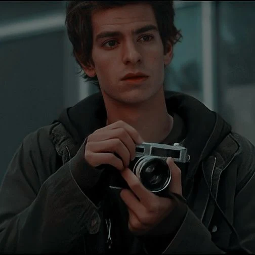 Peter Parker holding a camera