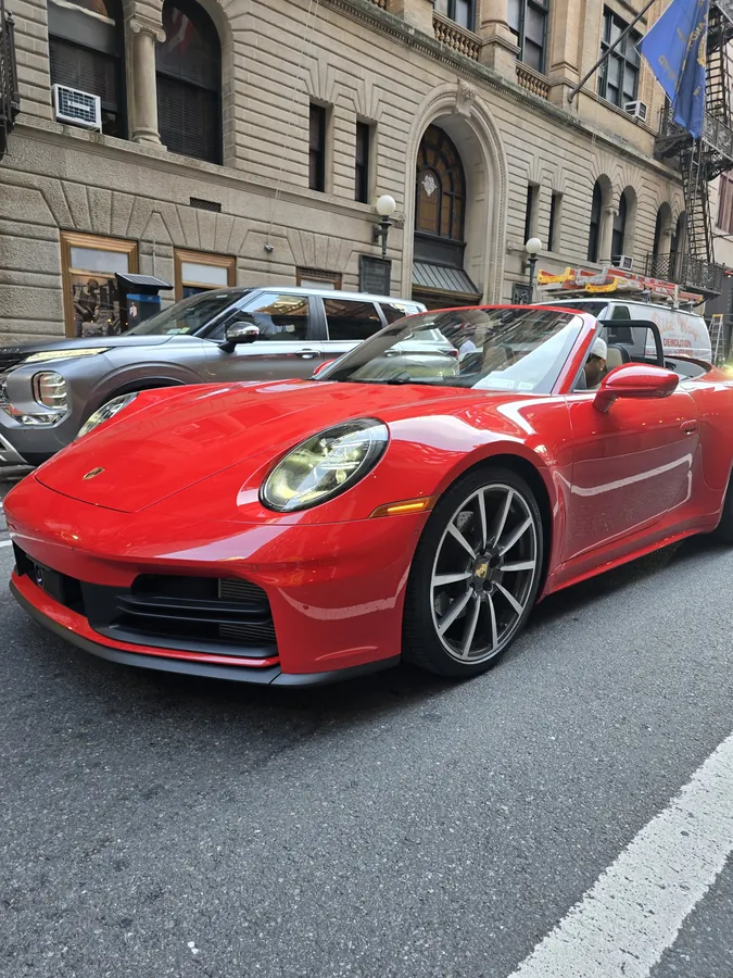 A red sports car parked along a New York street